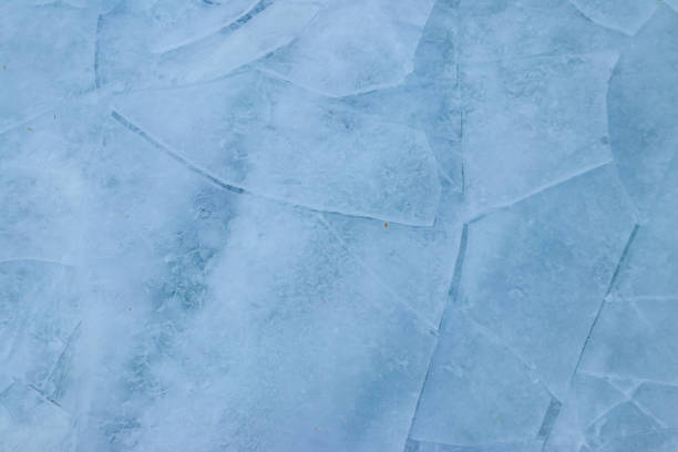 istock Texture of the cracked ice. Winter background 1345793967