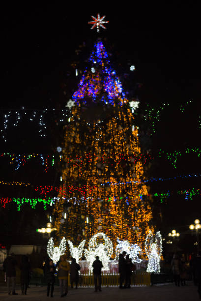 istock Bokeh silhouette of Christmas tree 1345794814
