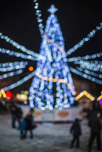 istock Bokeh silhouette of Christmas tree 1345794816