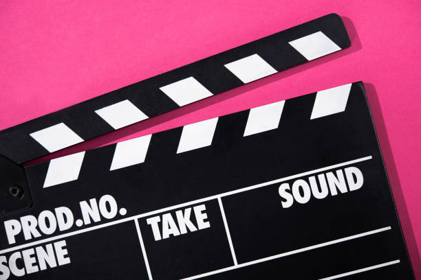 istock Movie clapper on a pink background. 1345795046