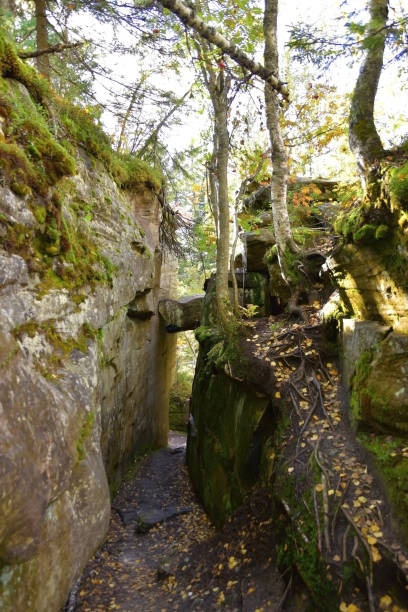 istock A through narrow gap is an arch between quartz sandstone megaliths 1345805749