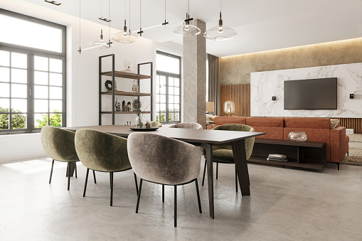 Modern apartment dining room interior. Dining room, velvet chairs, dining table, concrete floor, pendant lamps, leather sofa, windows, TV screen and marble panel in the background. Copy space template. Render.