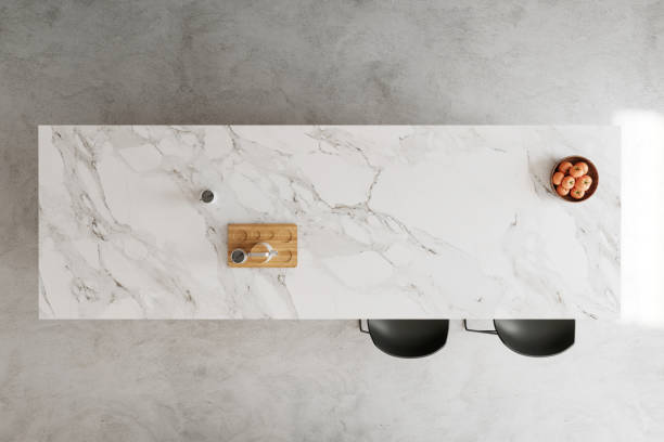 Modern kitchen island top view Marble kitchen island countertop top view, bar stools, concrete floor and details. Copy space template. Render. kitchen counter stock pictures, royalty-free photos & images