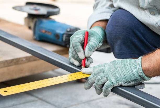 istock man measures metal with a ruler for cutting 1345813675