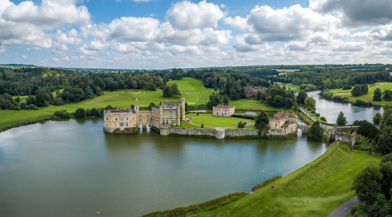 Maidston, UK- August 27, 2021:The drone arial view of Leeds castle. Leeds Castle is a castle in Kent, England, southeast of Maidstone. It is built on islands in a lake formed by the River Len.
