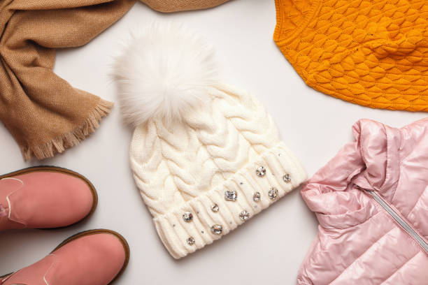 istock A set of warm autumn-winter clothes on a light gray background. Flat top view copy space 1345816575