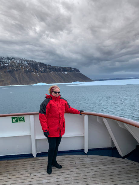 istock Single woman exploring the Antarctic peninsula 1345817720