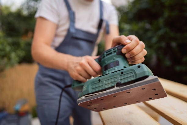 istock Unrecognizable male carpenter holding a sanding machine 1345818860