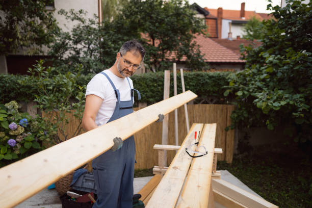 istock Focused carpenter, making sure that there are no irregularities on the timber surface 1345819566