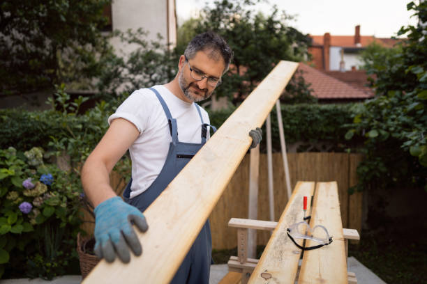 istock Carpenter making sure that the surface of timber are smooth and without irregularities 1345819568