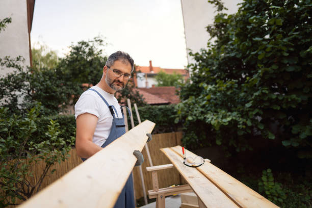 istock Curious and dedicated carpenter checking his previous work on the timber at his workshop 1345819579