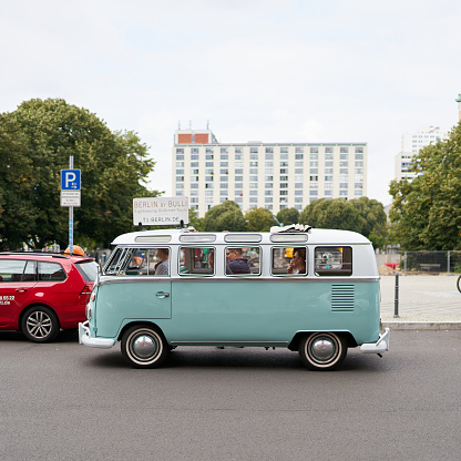 Berlin, Germany – September 12, 2021: Sightseeing tour with guide in an old VW Bulli through the city center of Berlin