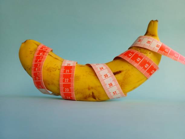 istock Banana wrapped with a tape measure 1345823486