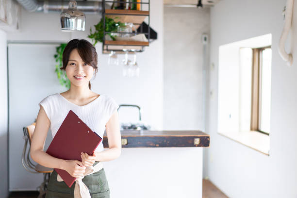 istock Young female staff working at a cafe 1345824360