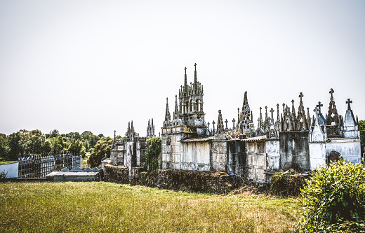 LUGO, SPAIN; AUGUST 23, 2021: Gothic cemetery in daytime natural landscape and clear sky