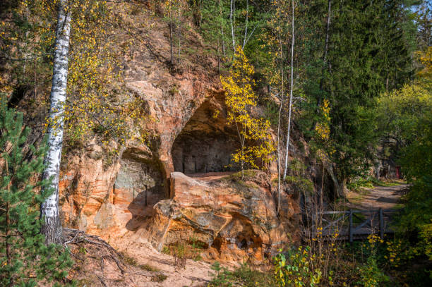 istock Cave in a Cliff in Autumn in Latvia 1345828737