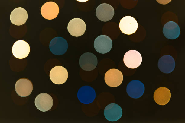 blurred lights of a garland of cold colors. - martini cocktail christmas blue imagens e fotografias de stock