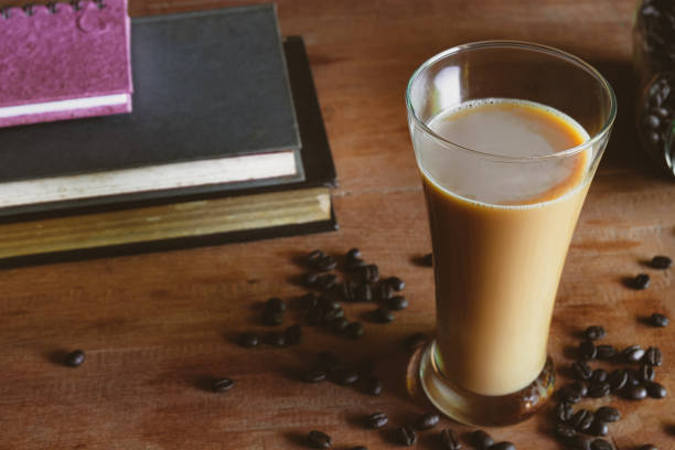 istock Coffee latte in tall glass, rustic style and refreshment. 1345836720