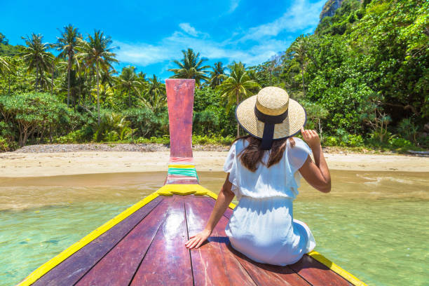 istock Woman on boat in Thailand 1345838500
