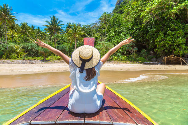 istock Woman on boat in Thailand 1345838574