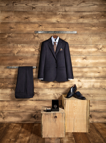 Men’s clothing and personal accessories isolated on wooden background (with clipping path)