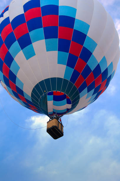 istock Single Colorful Hotair Balloon in Flight 1345839417