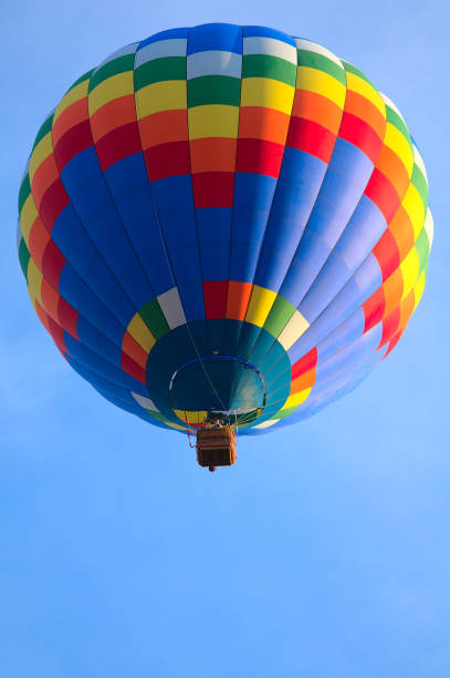 istock Single Colorful Hotair Balloon in Flight 1345839595