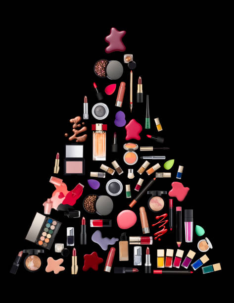 Christmas tree made of beauty product isolated on black background