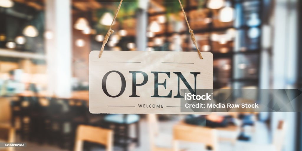 Open sign in front of door café and restaurant Open sign in front of door café and restaurant, new authorization to receive clients Open Sign Stock Photo