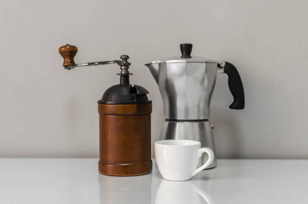 istock Manual coffee grinder with geyser coffee maker and cup 1345841326