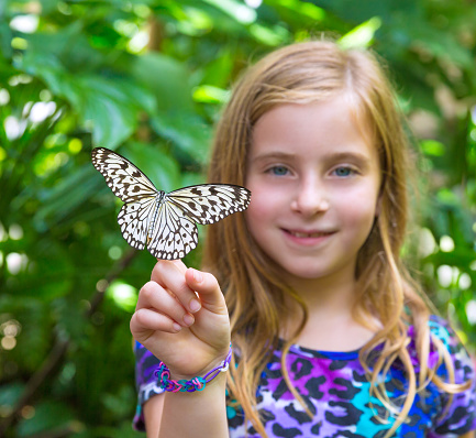 Girl holding finger Rice Paper butterfly Idea leuconoe in outdoor