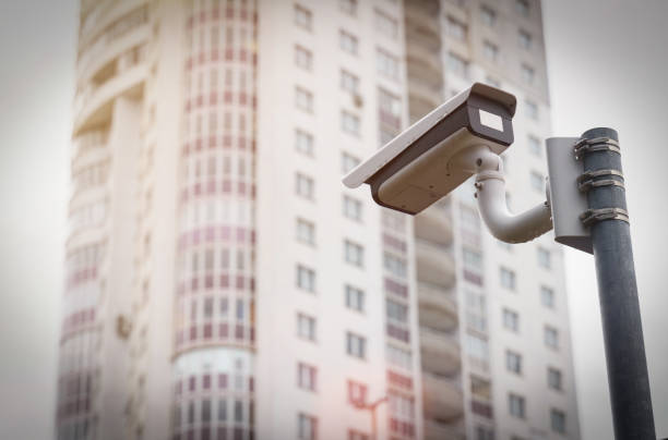 istock CCTV camera is aimed at a residential multi-storey building. House in blur. 1345842020
