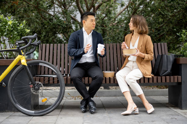 istock Business people having lunch at work in city 1345842114
