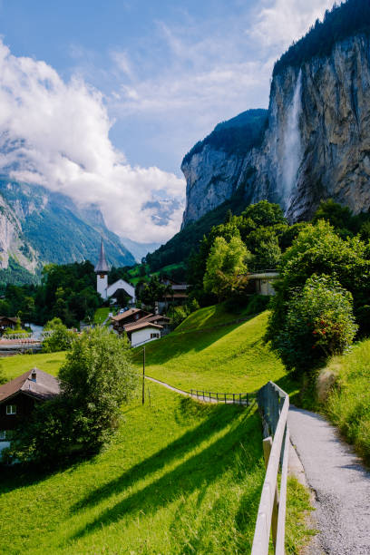 famous lauterbrunnen valley with gorgeous waterfall and swiss alps in the background, berner oberland, switzerland, europe - jungfrau waterfall tree nature imagens e fotografias de stock