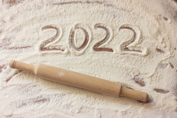 istock numbers 2022 on flour and a rolling pin on the table 1345847894