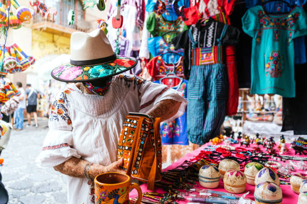 istock unrecognizable latina grandma buying souvenirs 1345847963