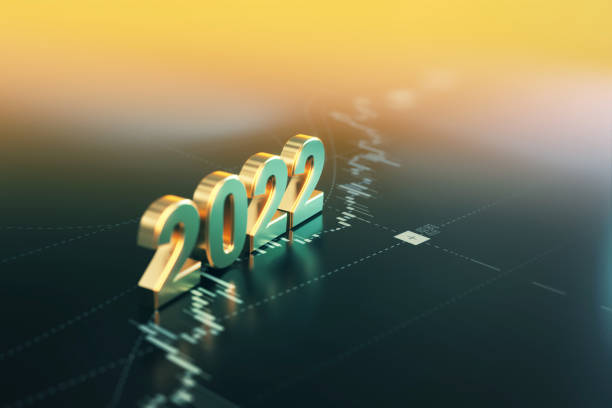 investment and finance concept - 2022 sitting on yellow financial graph background - mundial 2022 imagens e fotografias de stock