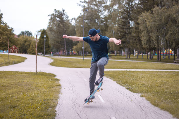 istock Young skateboarder in action mid air 1345856068