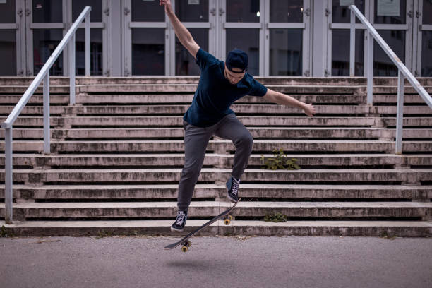 istock Young skateboarder in action mid air 1345856307