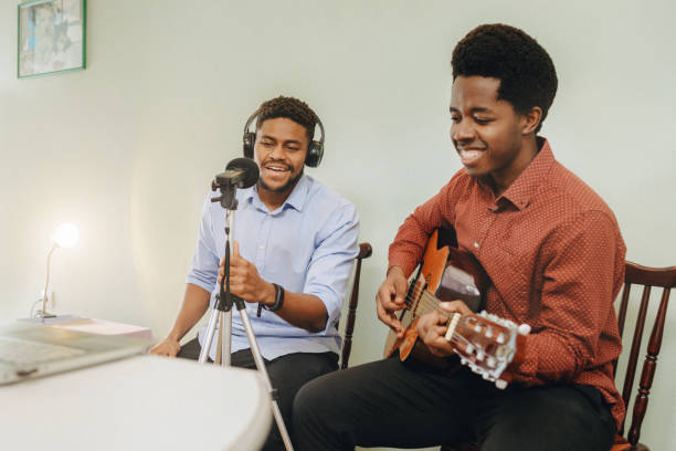 istock Two Afro-American playing musical instruments at home 1345857362