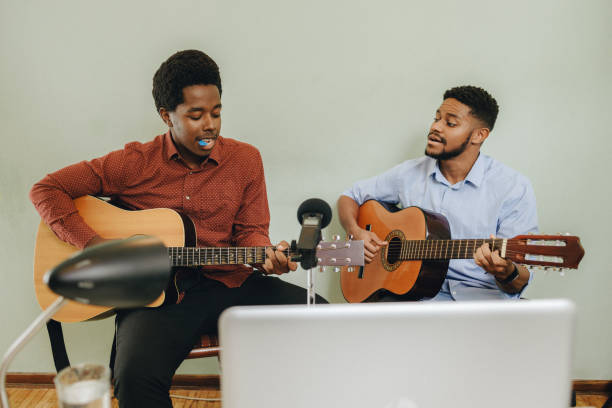 istock Two Afro-American playing musical instruments at home 1345857686