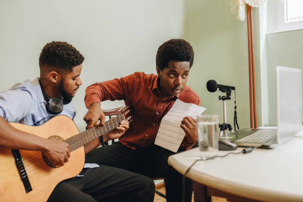 istock Two Afro-American playing musical instruments at home 1345857850