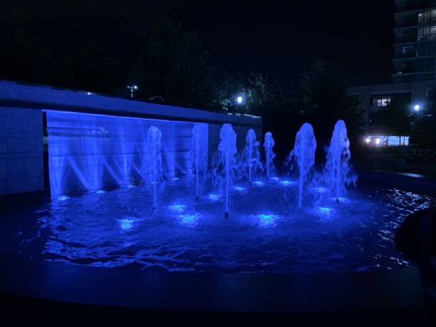 istock Blue Illuminated Fountain At Night 1345858561