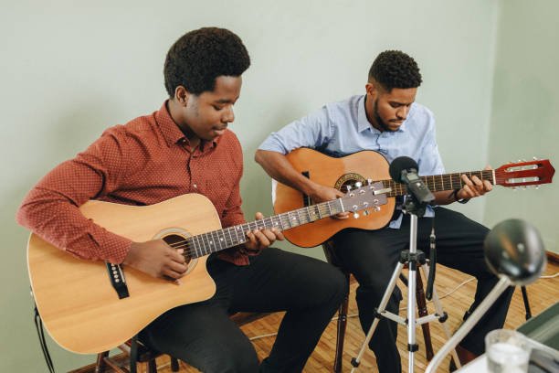 istock Two Afro-American playing musical instruments at home 1345858778