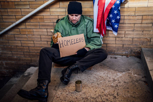 istock Homeless with alcohol bottle on the subway station 1345859056