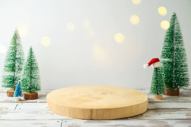istock Empty wooden log  on rustic table over festive winter  background.  Christmas and New Year mock up for design and product display. 1345861366
