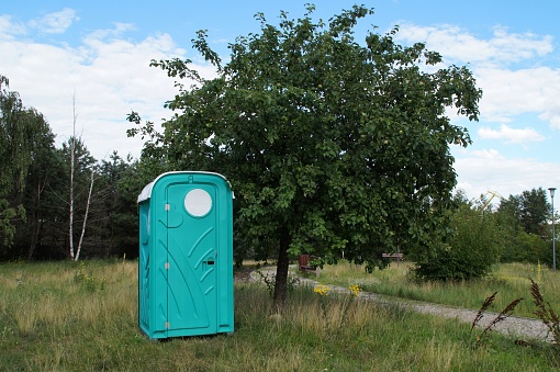 portable chemical toilet in the park