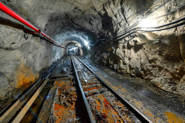 istock Underground mine. Underground railway for transporting ore. Mine trolley as part of an underground freight train 1345864770