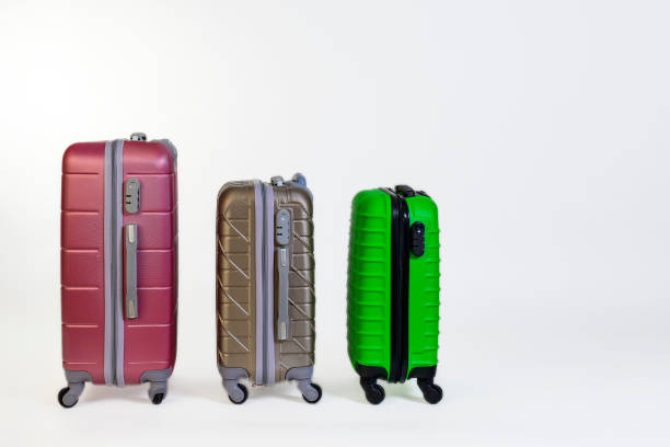 istock Elegant suitcases on a color background. 1345865542