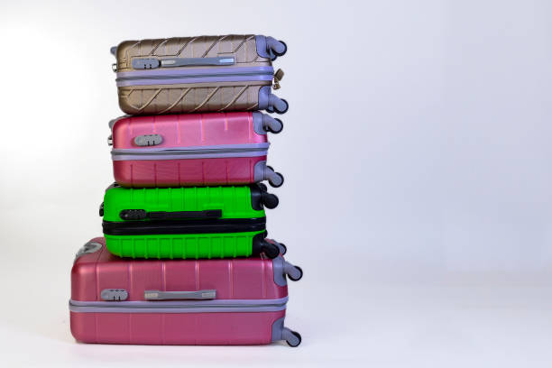 istock Elegant suitcases on a color background. 1345865546